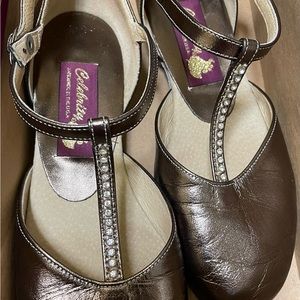 Woman’s dance flats, BRONZE color, sued soles, adjustable straps.